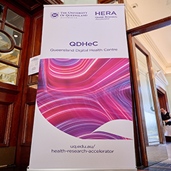 QDHeC banner at 2024 Symposium