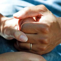 carer holding hands