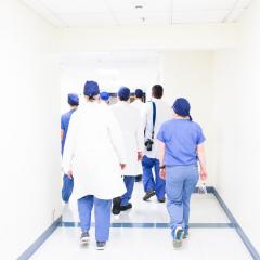 Doctors walking down hallway